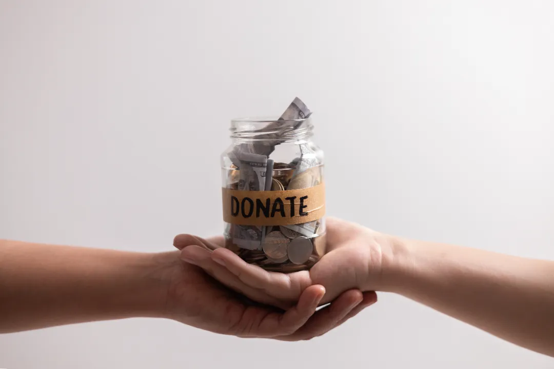 236920163_m Manage her income wisely she used jar to save coins and cash, balancing her financial needs between finance and desire to donate money.